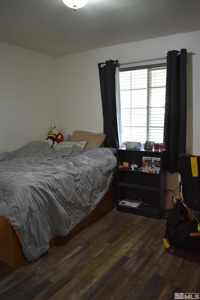 bedroom with wood finished floors