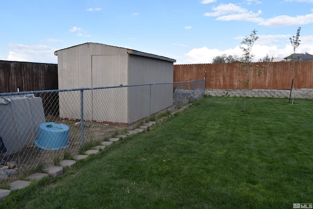 view of yard with an outbuilding and a shed
