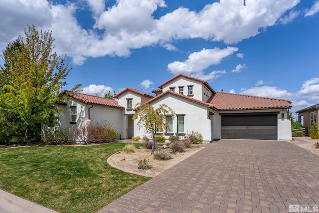 10198 Via Como, Reno, NV 89511 - mediterranean / spanish-style house with stucco siding, an attached garage, a tile roof, and a front yard