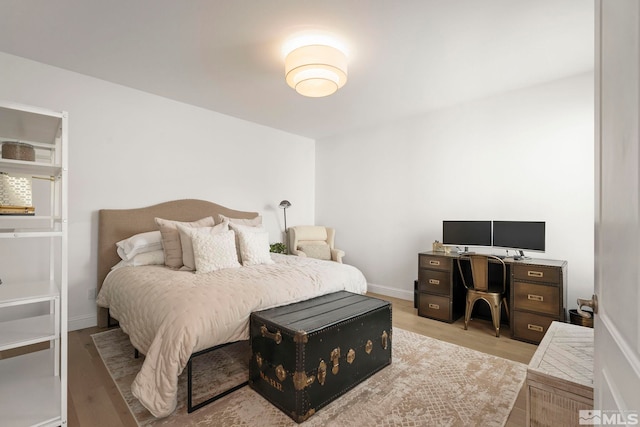 10198 Via Como, Reno, NV 89511 - bedroom featuring light wood-type flooring, a desk, and baseboards