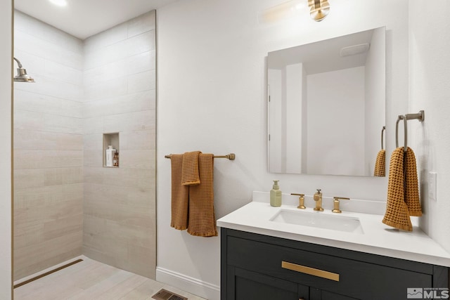 10198 Via Como, Reno, NV 89511 - bathroom featuring vanity, a tile shower, and baseboards