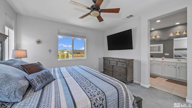 2282 Selway Dr, Sparks, NV 89436 - bedroom with light colored carpet, baseboards, a sink, a ceiling fan, and light tile patterned floors