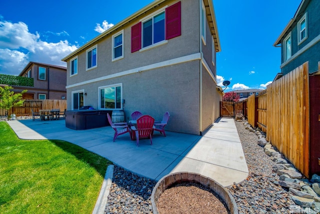 2282 Selway Dr, Sparks, NV 89436 - back of property featuring a patio, a hot tub, and stucco siding