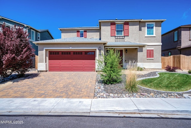 2282 Selway Dr, Sparks, NV 89436 - traditional-style house with decorative driveway, an attached garage, and stucco siding