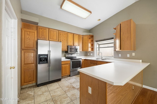 2120 Keystone Ave, Reno, NV 89503 - kitchen with appliances with stainless steel finishes, open shelves, lofted ceiling, a peninsula, and light countertops