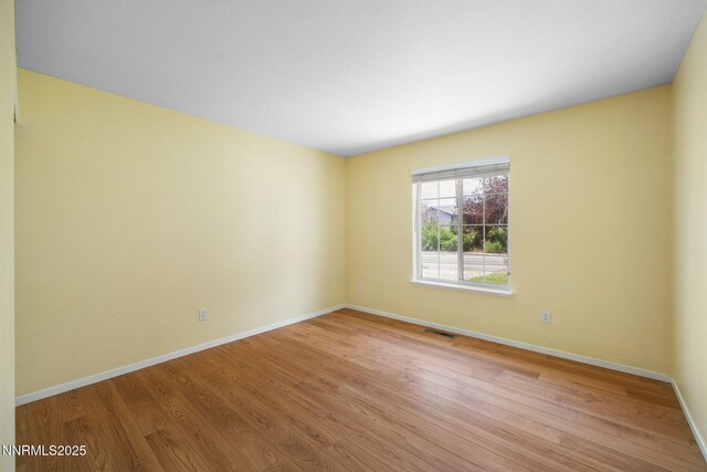 2120 Keystone Ave, Reno, NV 89503 - spare room with light wood-type flooring and baseboards