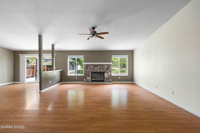 2120 Keystone Ave, Reno, NV 89503 - unfurnished living room with a ceiling fan, light wood-style floors, and a fireplace