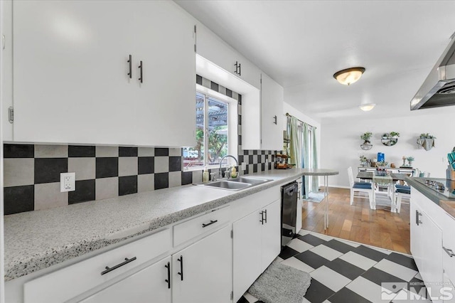 445 S Bailey, Fallon, NV 89406 - kitchen with a sink, light countertops, dishwasher, decorative backsplash, and white cabinets