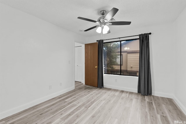 4580 Matich Dr, Reno, NV 89502 - unfurnished room featuring ceiling fan, light wood-type flooring, baseboards, and a textured ceiling