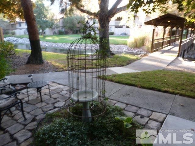 4650 Rio Poco Rd, Reno, NV 89502 - view of property's community with a water view and a patio area