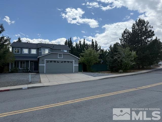 6700 Sandia Dr, Reno, NV 89523 - traditional-style house with an attached garage, driveway, and fence