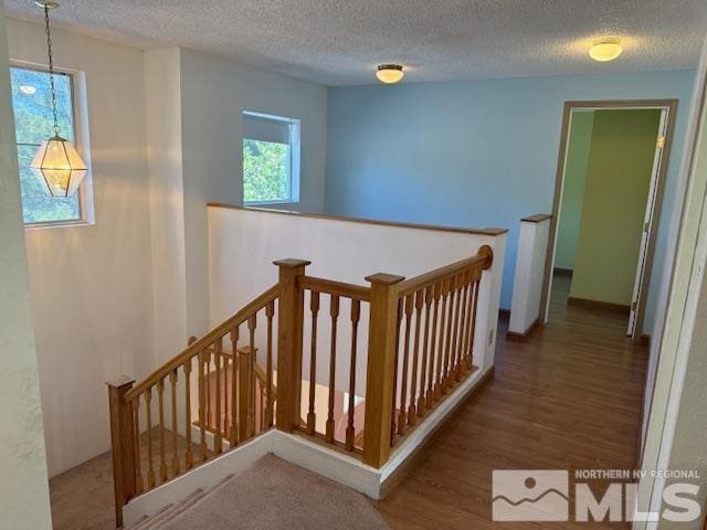 6700 Sandia Dr, Reno, NV 89523 - stairway featuring wood finished floors and a textured ceiling