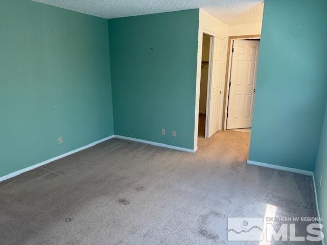 6700 Sandia Dr, Reno, NV 89523 - unfurnished bedroom with carpet, a textured ceiling, and baseboards