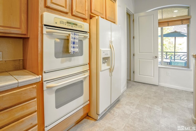9900 Wilbur May Unit 3403, Reno, NV 89521 - kitchen featuring white appliances and tile countertops