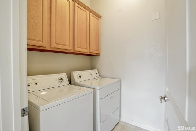 9900 Wilbur May Unit 3403, Reno, NV 89521 - laundry area featuring separate washer and dryer, cabinet space, and light tile patterned flooring