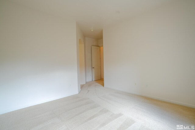 9900 Wilbur May Unit 3403, Reno, NV 89521 - unfurnished room with light carpet and arched walkways