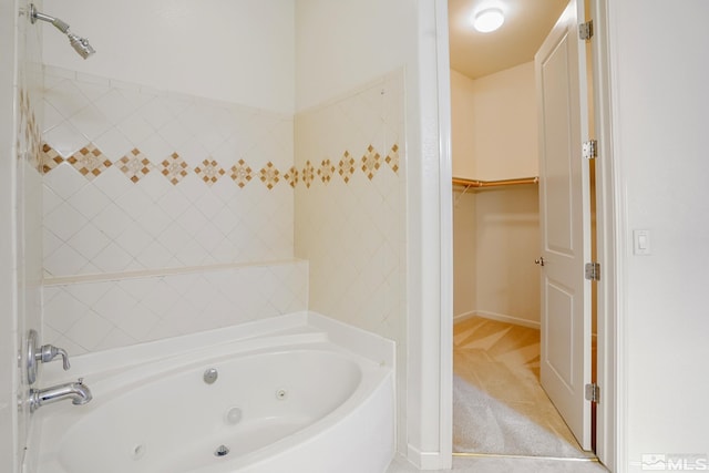 9900 Wilbur May Unit 3403, Reno, NV 89521 - full bathroom with a whirlpool tub, a spacious closet, and baseboards