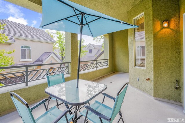 9900 Wilbur May Unit 3403, Reno, NV 89521 - view of patio / terrace featuring a balcony and outdoor dining area