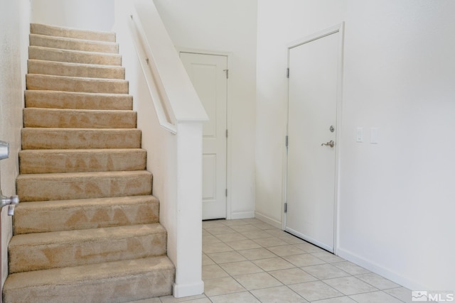 9900 Wilbur May Unit 3403, Reno, NV 89521 - staircase featuring tile patterned flooring and baseboards