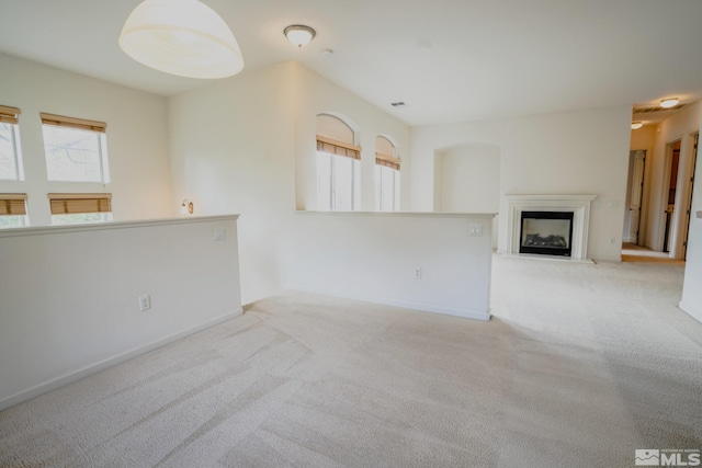 9900 Wilbur May Unit 3403, Reno, NV 89521 - unfurnished living room with carpet flooring, a fireplace, and baseboards