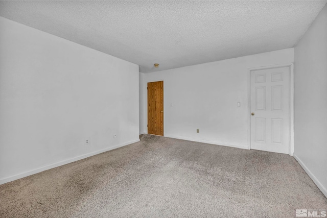 3865 E Leonesio Dr Unit F1, Reno, NV 89512 - spare room with carpet flooring, a textured ceiling, and baseboards