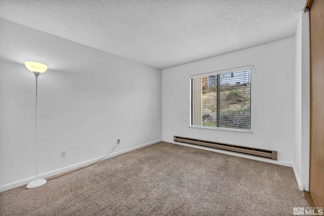 3865 E Leonesio Dr Unit F1, Reno, NV 89512 - carpeted spare room with a baseboard radiator, a textured ceiling, and baseboards