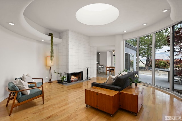 2040 Scharr Cir, Reno, NV 89509 - living room with light wood-style floors, recessed lighting, a fireplace, and baseboards