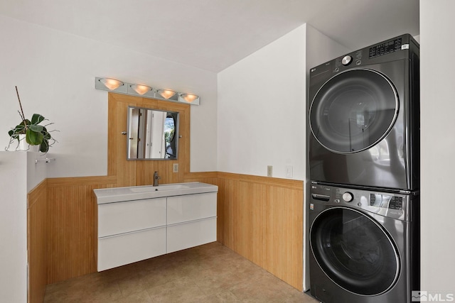 2040 Scharr Cir, Reno, NV 89509 - laundry room featuring stacked washer / dryer, wainscoting, and wooden walls