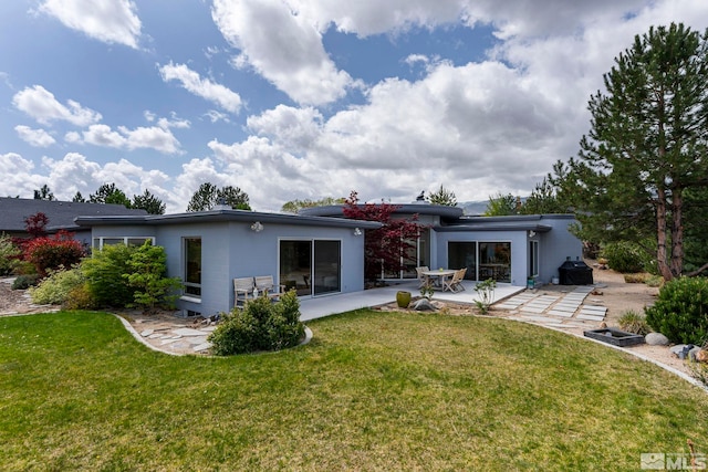 2040 Scharr Cir, Reno, NV 89509 - rear view of house with a patio and a yard