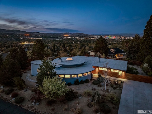 2040 Scharr Cir, Reno, NV 89509 - patio terrace at dusk with a mountain view