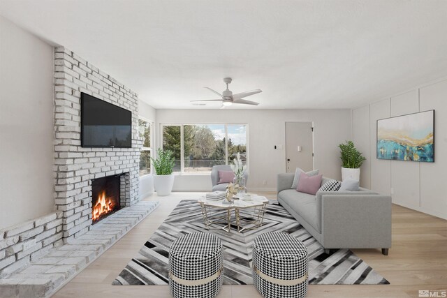 983 Melba Dr, Reno, NV 89503 - living area featuring wood finished floors, a brick fireplace, and ceiling fan