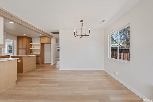 983 Melba Dr, Reno, NV 89503 - unfurnished dining area featuring a chandelier, baseboards, light wood-style flooring, and recessed lighting