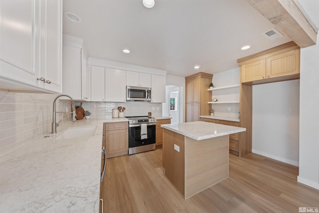 983 Melba Dr, Reno, NV 89503 - kitchen with stainless steel appliances, a sink, open shelves, decorative backsplash, and a kitchen island