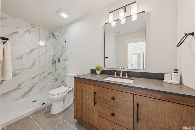 983 Melba Dr, Reno, NV 89503 - full bath featuring a marble finish shower, toilet, vanity, and tile patterned floors