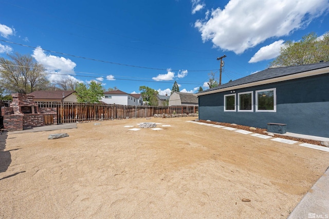 983 Melba Dr, Reno, NV 89503 - fenced backyard with an outdoor fire pit