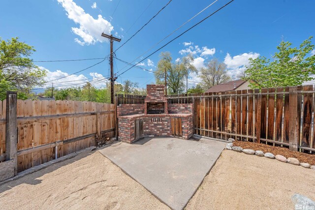 983 Melba Dr, Reno, NV 89503 - view of patio / terrace with a fireplace and fence