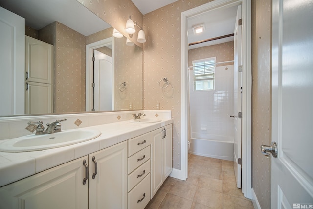 7609 Stone Bluff Way, Reno, NV 89523 - bathroom with wallpapered walls, double vanity, tile patterned floors, toilet, and shower / washtub combination