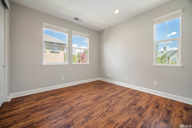 7609 Stone Bluff Way, Reno, NV 89523 - empty room featuring plenty of natural light, dark wood-style floors, baseboards, and recessed lighting