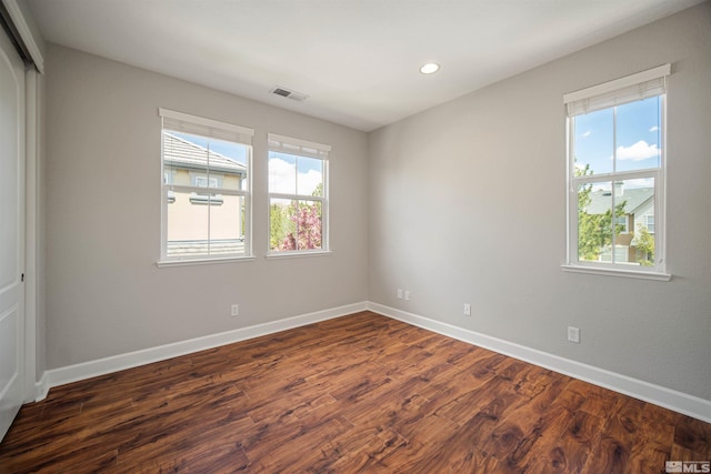 7609 Stone Bluff Way, Reno, NV 89523 - unfurnished room featuring baseboards, dark wood-style flooring, and recessed lighting