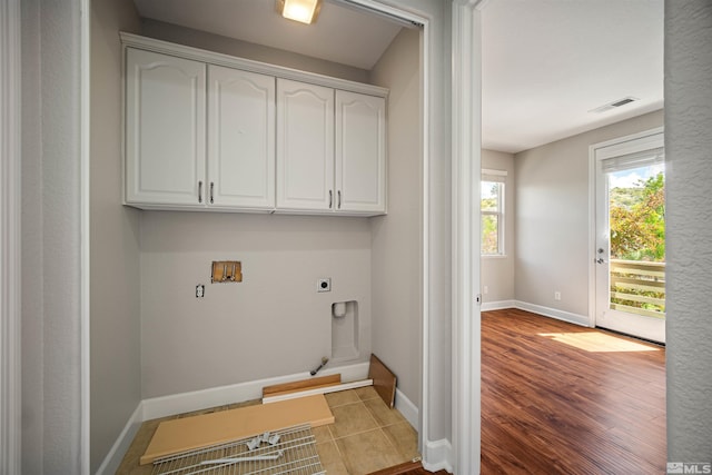 7609 Stone Bluff Way, Reno, NV 89523 - laundry area with hookup for an electric dryer, cabinet space, baseboards, and wood finished floors