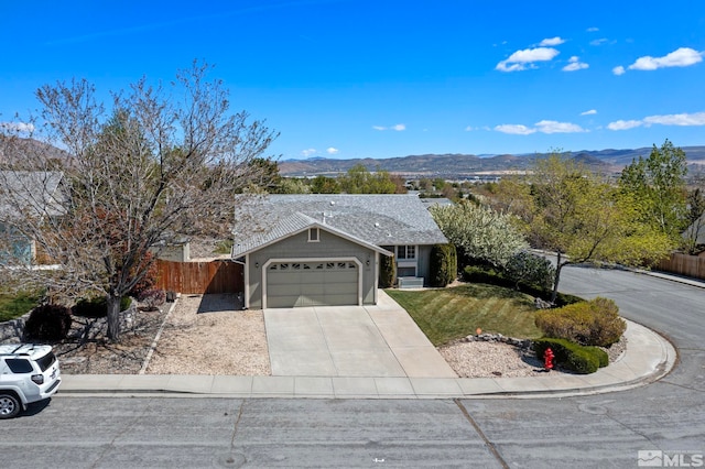 1359 Whooping Crane Dr, Sparks, NV 89441 - ranch-style house featuring a garage, a mountain view, and concrete driveway