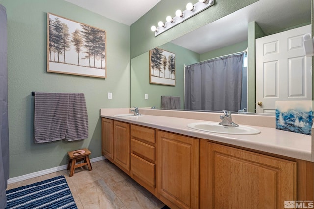 1359 Whooping Crane Dr, Sparks, NV 89441 - bathroom with double vanity, baseboards, and a shower with shower curtain