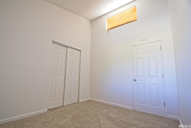 2375 Tripp Dr # 10, Reno, NV 89512 - unfurnished bedroom with carpet flooring, a closet, a textured ceiling, and baseboards