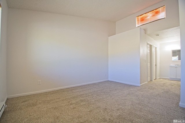 2375 Tripp Dr # 10, Reno, NV 89512 - carpeted empty room with a textured ceiling and baseboards