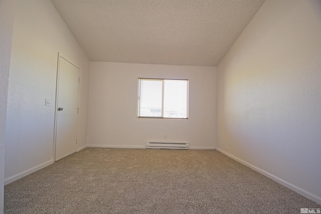 2375 Tripp Dr # 10, Reno, NV 89512 - carpeted spare room with a baseboard heating unit, a textured ceiling, and baseboards
