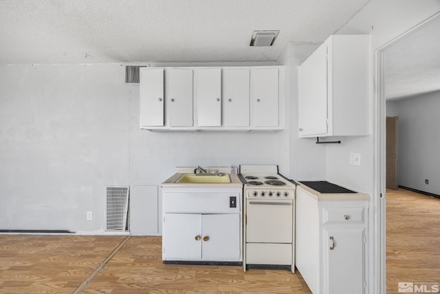 280 Island Ave Unit 1802, Reno, NV 89501 - kitchen with white range with electric stovetop, a sink, white cabinets, a textured ceiling, and light wood finished floors