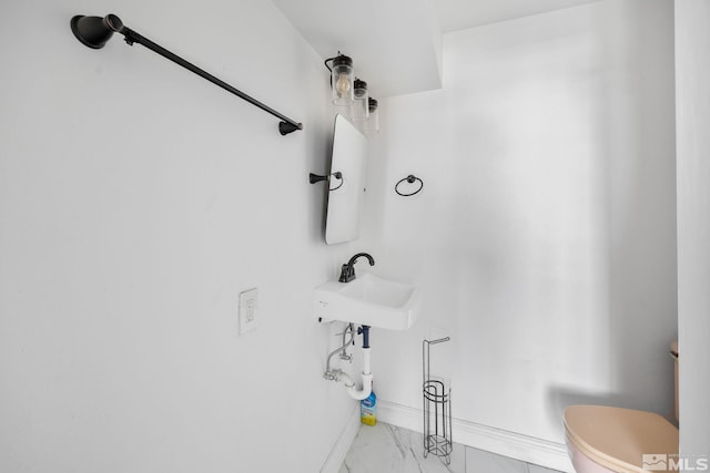 280 Island Ave Unit 1802, Reno, NV 89501 - half bath with marble finish floors, baseboards, toilet, and a sink