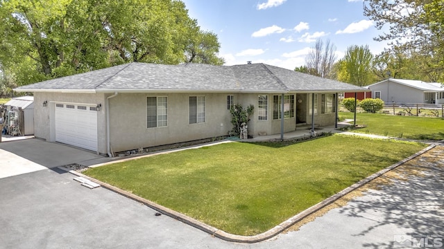 930 Edgewater, Fallon, NV 89406 - single story home with a garage, stucco siding, driveway, and roof with shingles
