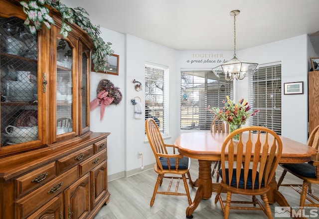 930 Edgewater, Fallon, NV 89406 - dining area featuring a chandelier, light wood finished floors, and baseboards