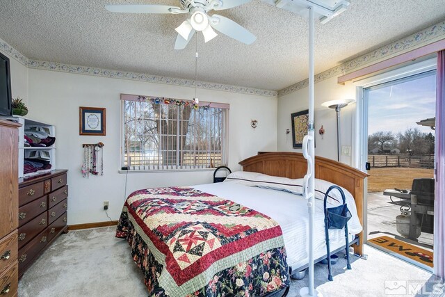 930 Edgewater, Fallon, NV 89406 - bedroom with a textured ceiling, carpet floors, a ceiling fan, baseboards, and access to outside